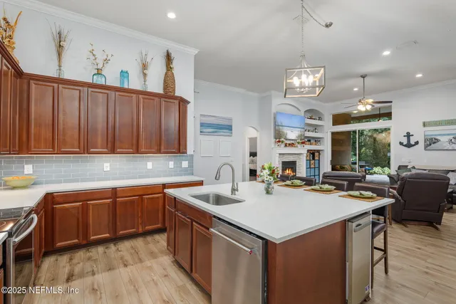 a spacious bedroom with a bed and a chandelier