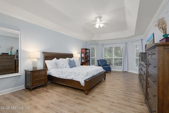 a view of walk in closet with clothes
