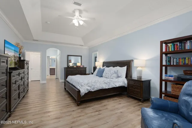 a bedroom with a bed and a dresser