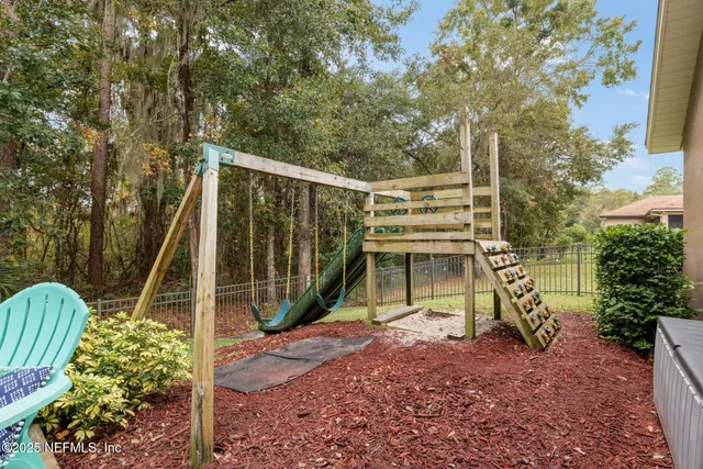 a view of a swimming pool with a yard