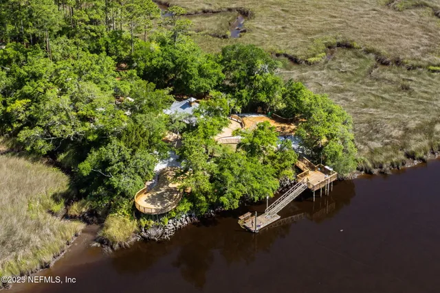 a view of a swimming pool with a patio and a yard