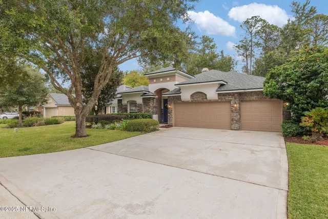 a front view of a building with garden