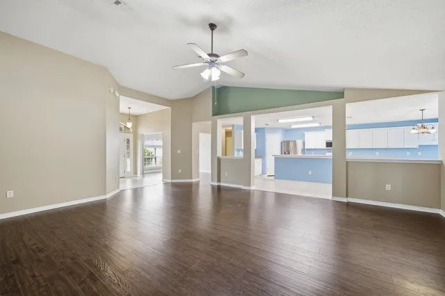 a kitchen with a stove a sink and a microwave