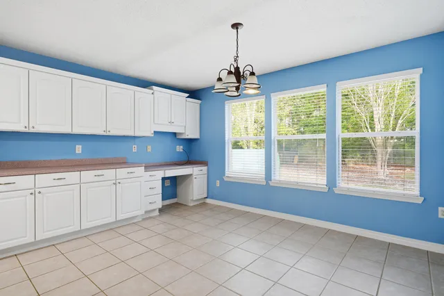 a view of empty room with sliding windows