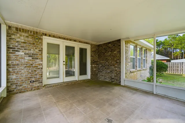 a bathroom with a granite countertop sink toilet a mirror a vanity and shower