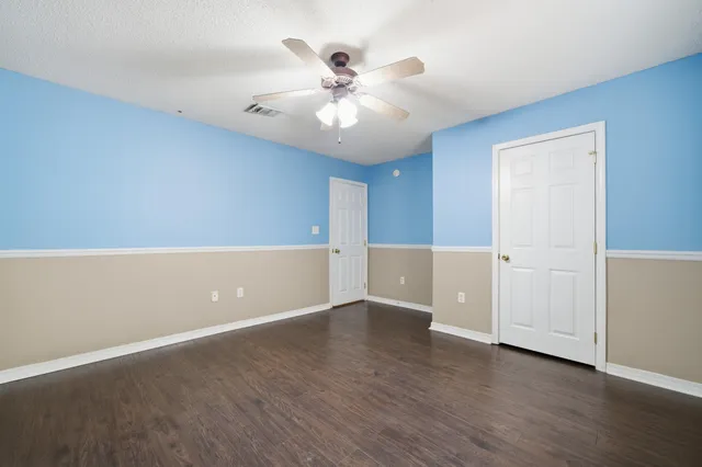 a view of a bathroom with a tub shower and a sink