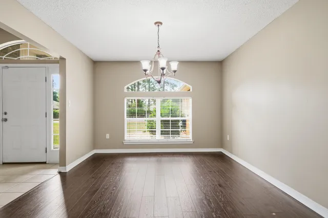 a view of a kitchen with a sink and dishwasher