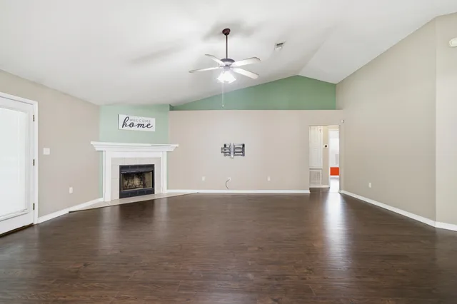 a kitchen with a refrigerator sink stove and cabinets