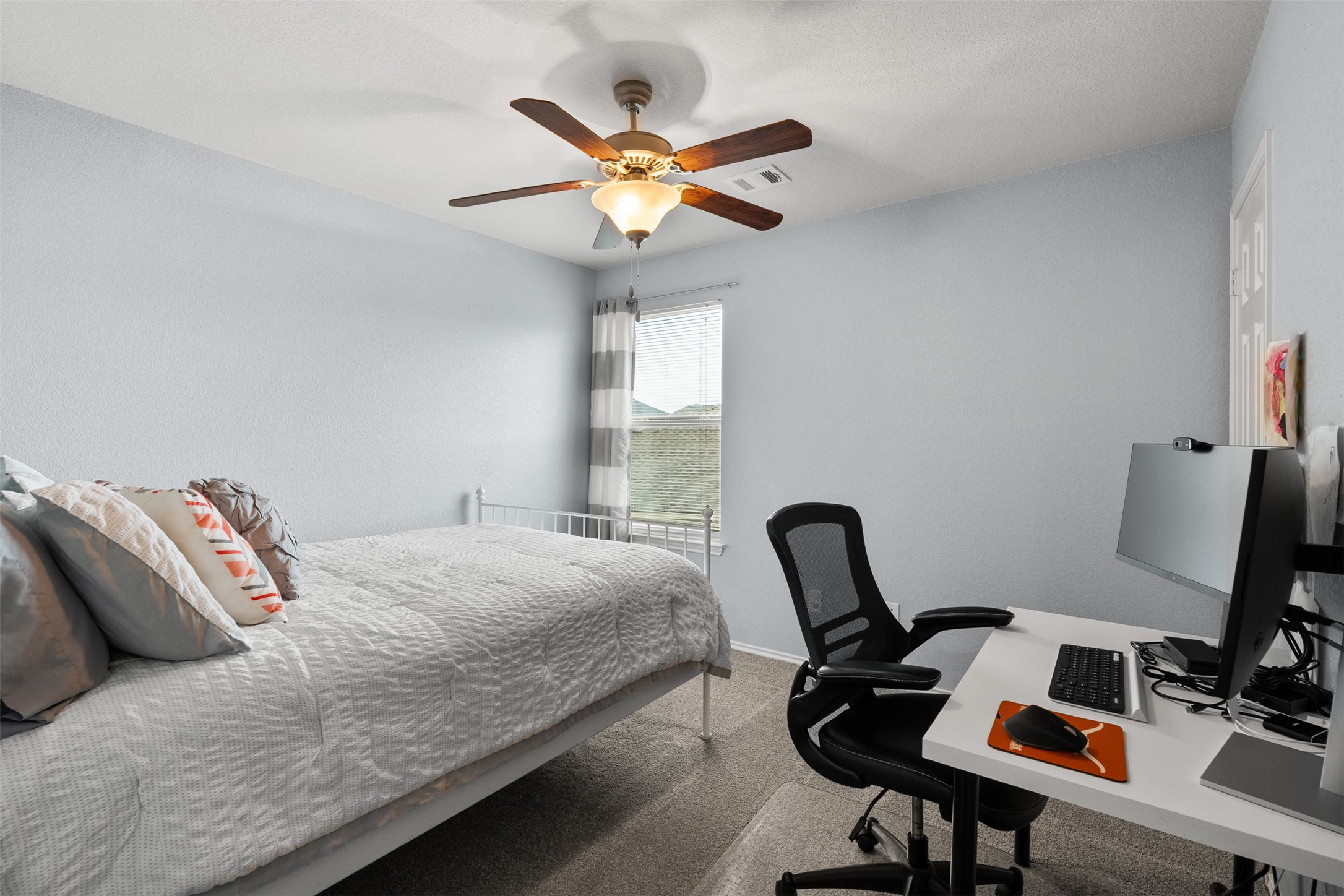 137 Barn Owl Loop Leander, TX 78641 - Photo 28 of 36 a bedroom with a bed and a window