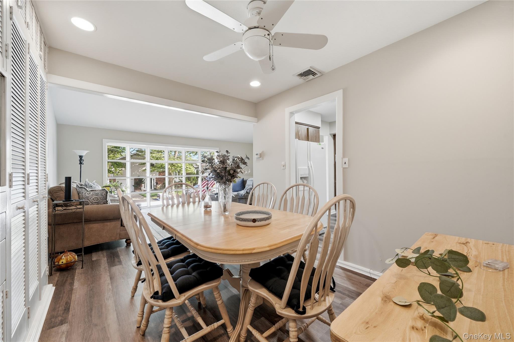 1853 Decatur Avenue Merrick, NY 11566 - Photo 13 of 43 a view of a dining room with furniture and wooden floor