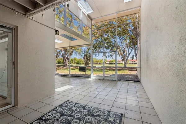 a view of n empty room with a window