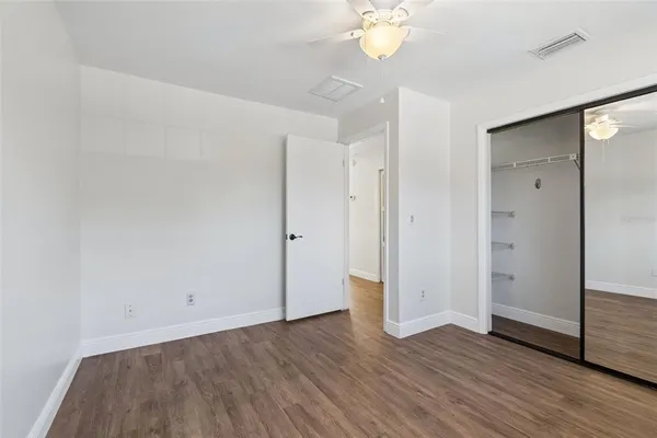 an aerial view of residential houses with outdoor space and street view
