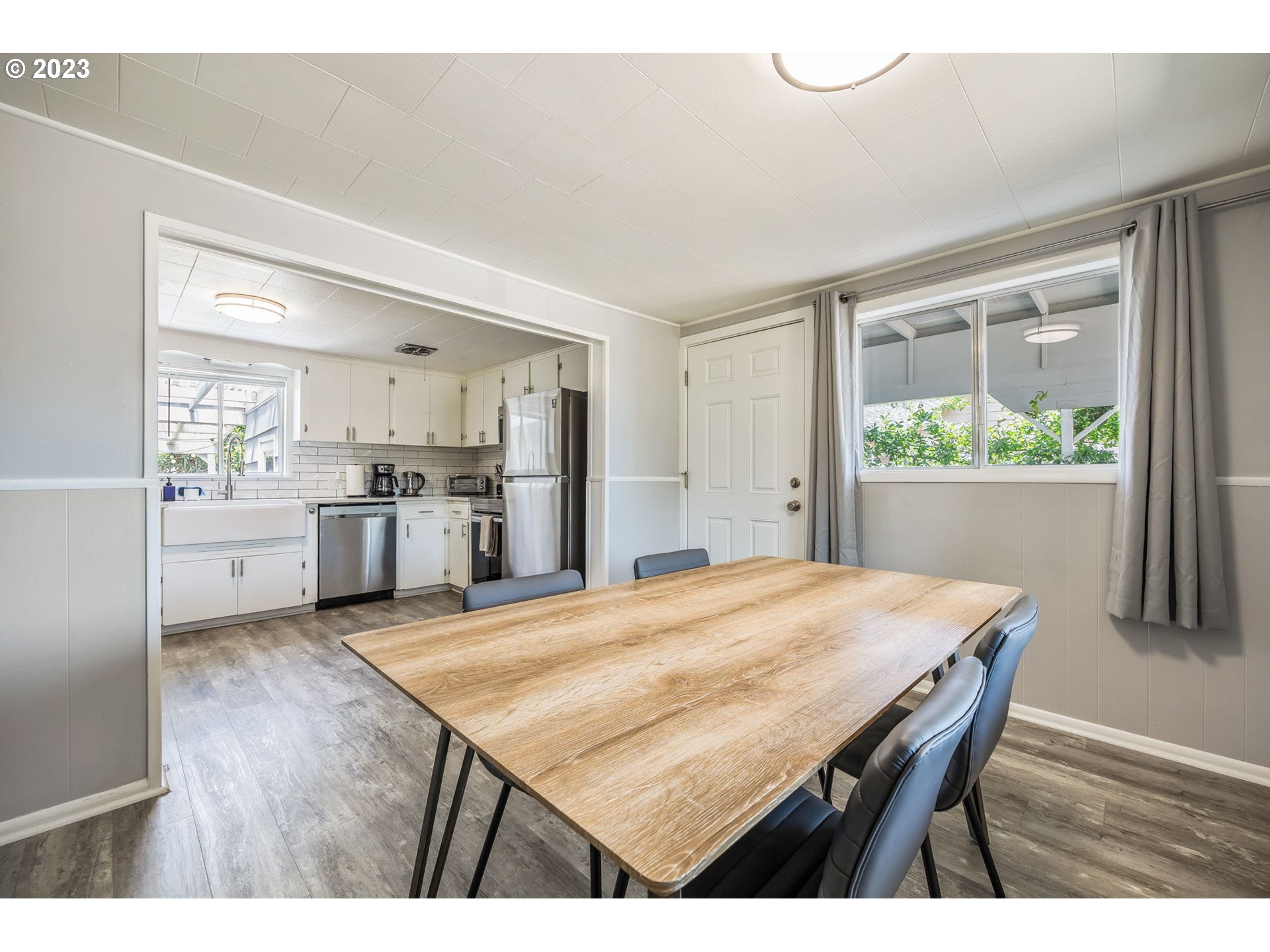 2290 E Street Springfield, OR 97477 - Photo 17 of 45 a open kitchen with a table and chairs