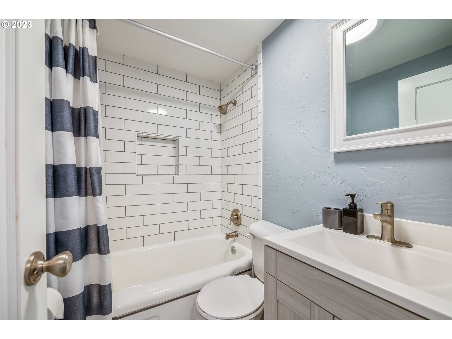 2290 E Street Springfield, OR 97477 - Photo 32 of 45 a bathroom with a bathtub shower sink vanity and toilet