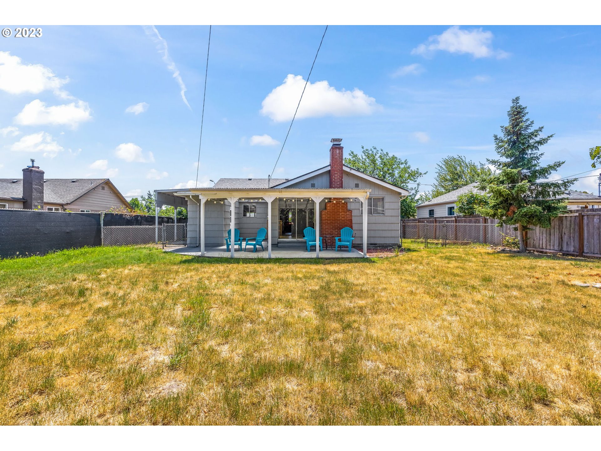 2290 E Street Springfield, OR 97477 - Photo 38 of 45 a view of a house with a backyard and a patio