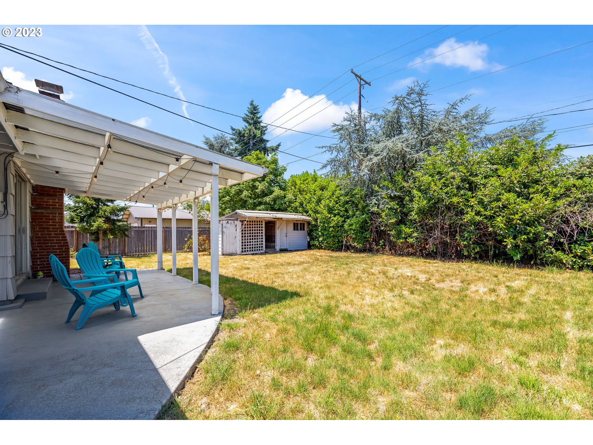 2290 E Street Springfield, OR 97477 - Photo 42 of 45 a view of a patio with table and chairs potted plants with wooden floor