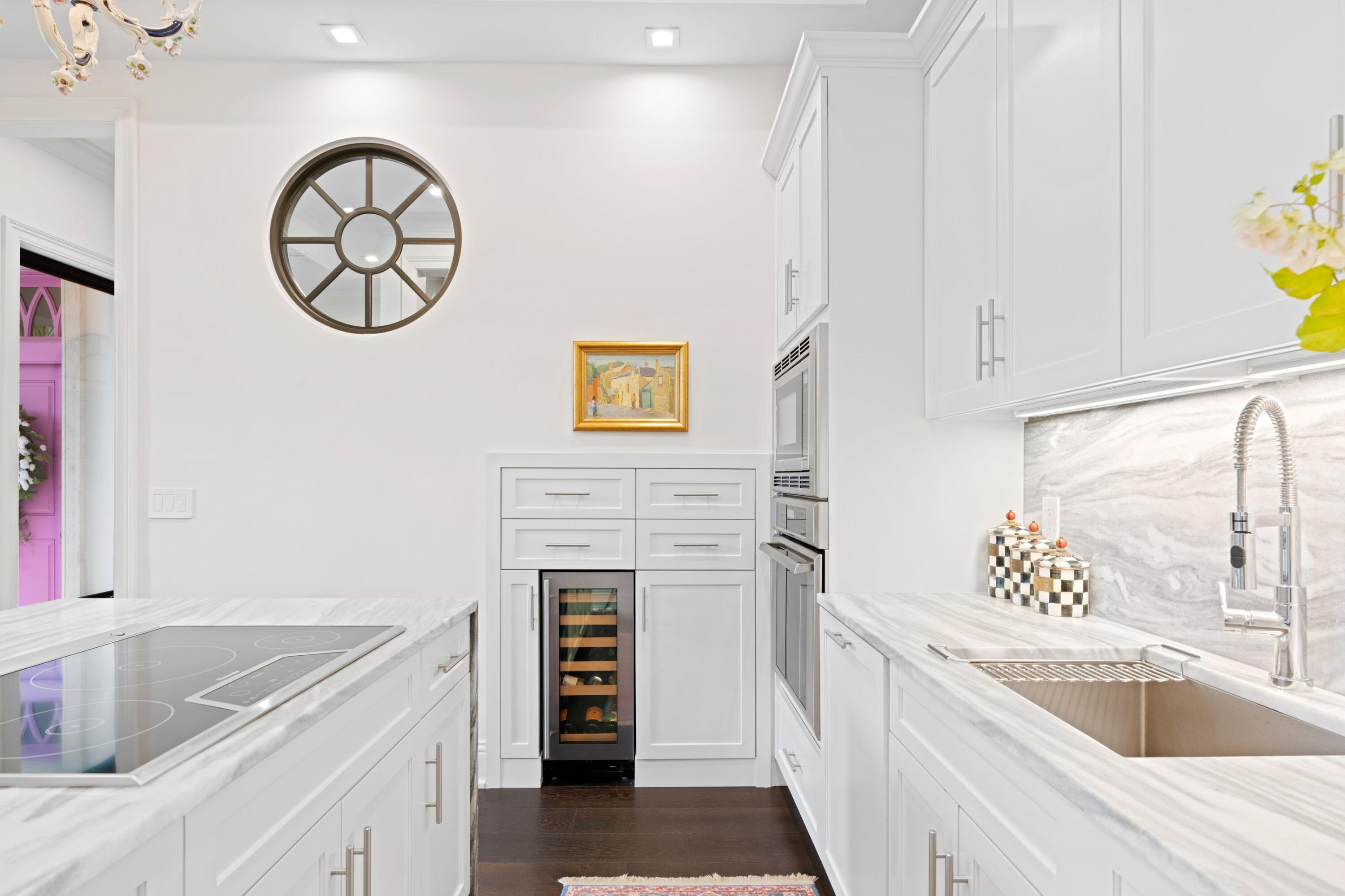 533 Westwood Road West Palm Beach, FL 33401 - Photo 12 of 43 a kitchen with a refrigerator and a sink