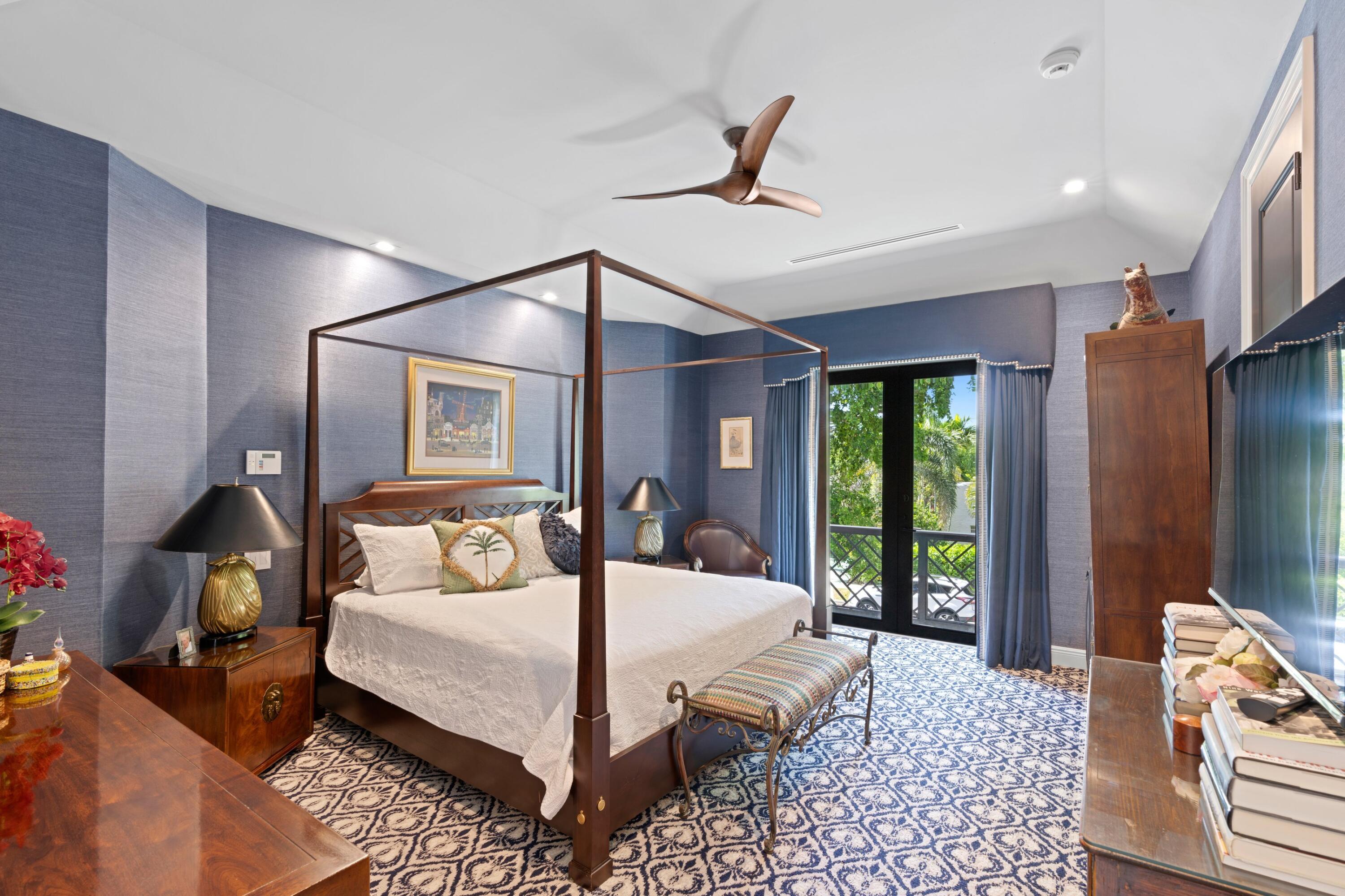 533 Westwood Road West Palm Beach, FL 33401 - Photo 22 of 43 a bedroom with a large bed and a chandelier