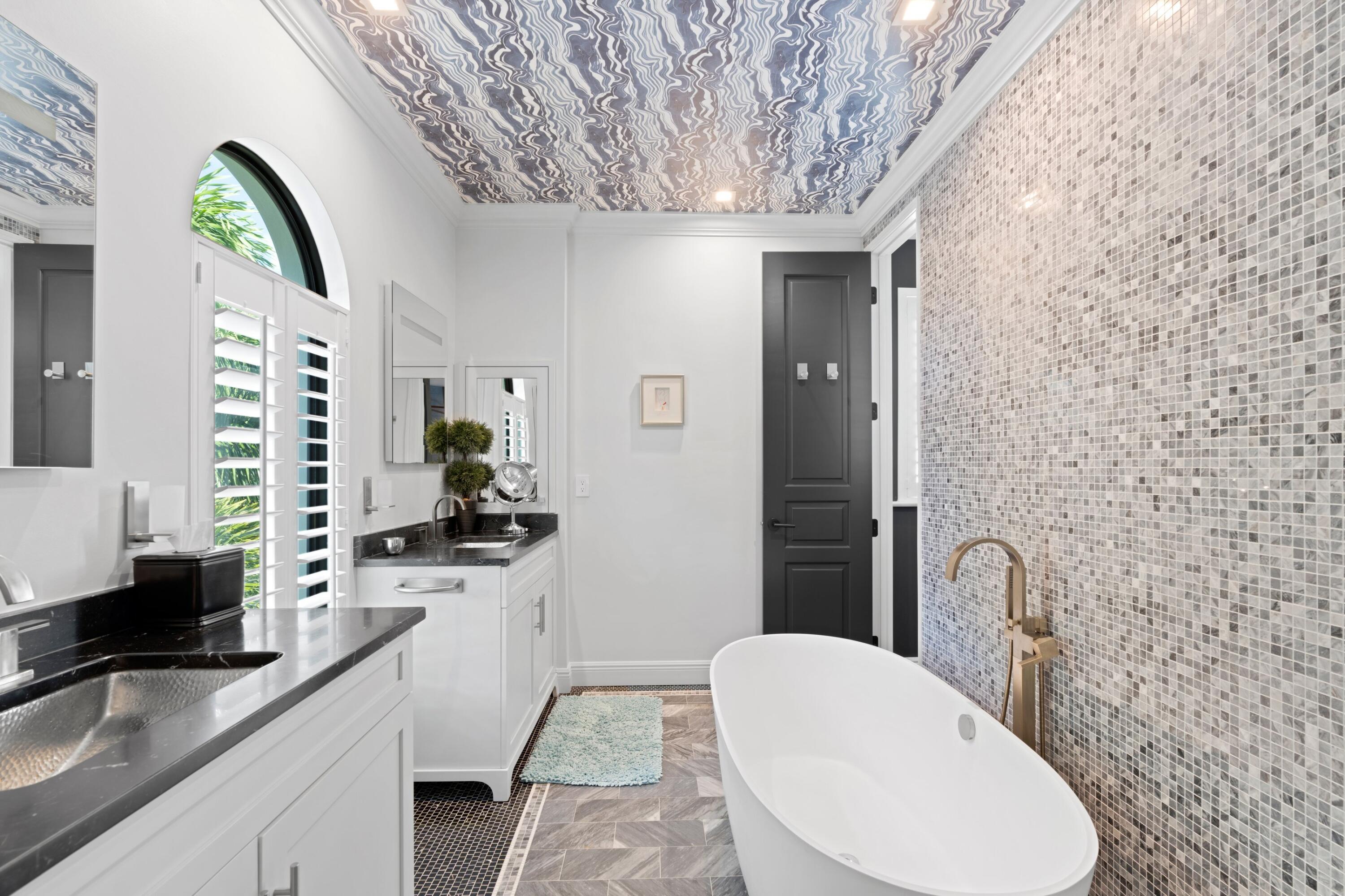 533 Westwood Road West Palm Beach, FL 33401 - Photo 25 of 43 a bathroom with a granite countertop sink a toilet and mirror