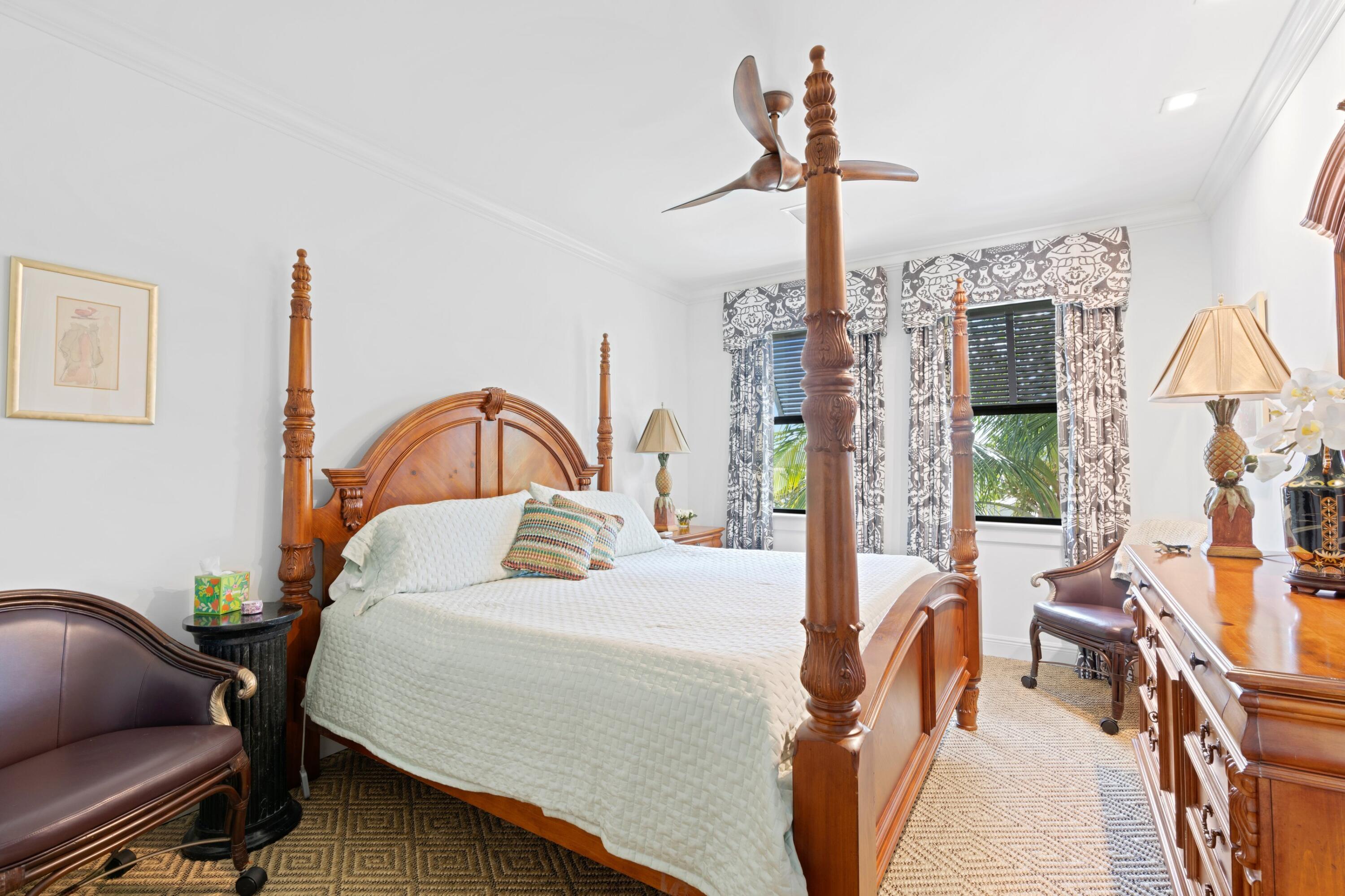 533 Westwood Road West Palm Beach, FL 33401 - Photo 28 of 43 a bedroom with a bed chair and a large window