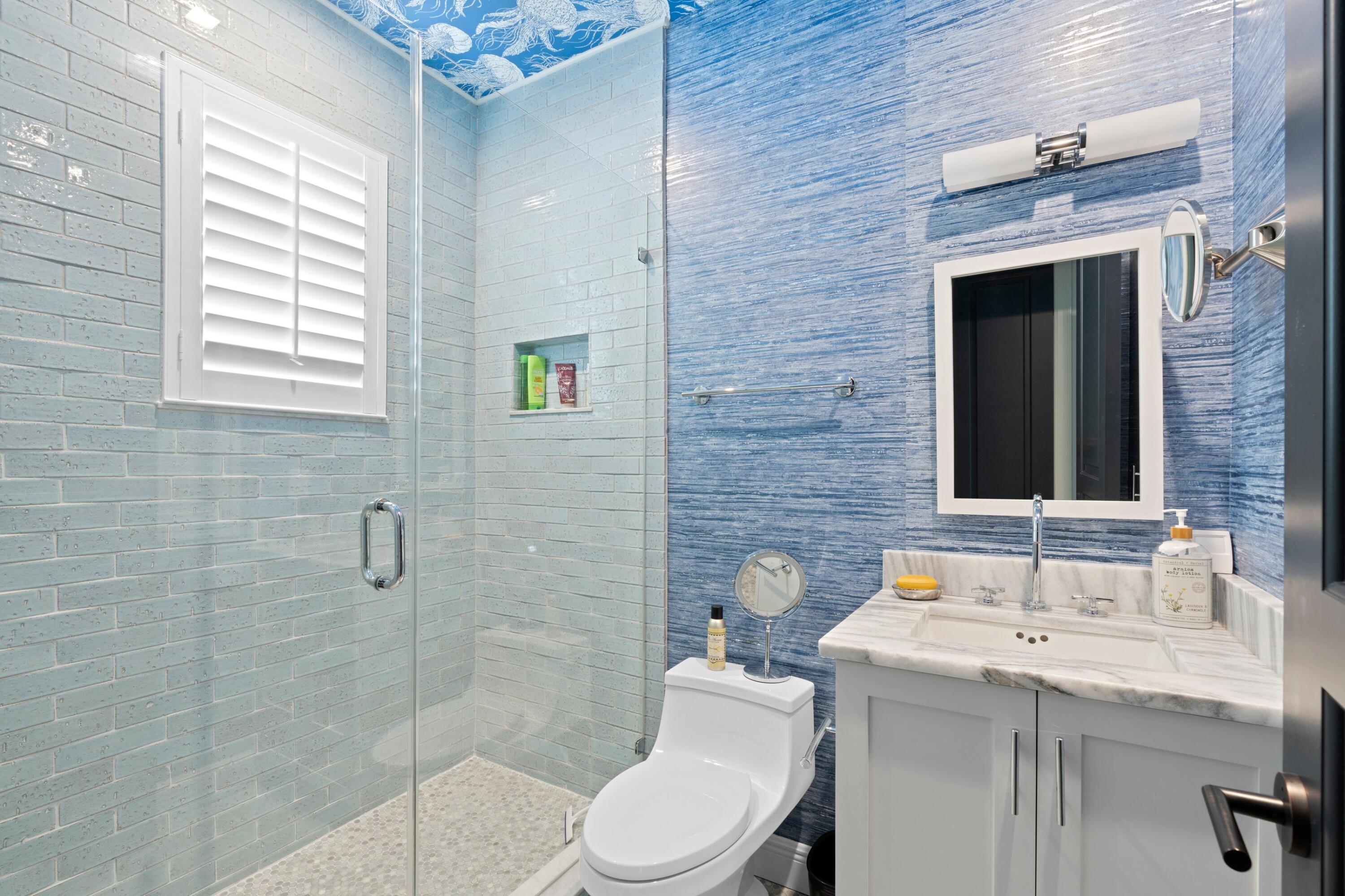 533 Westwood Road West Palm Beach, FL 33401 - Photo 29 of 43 a bathroom with a sink a toilet and shower