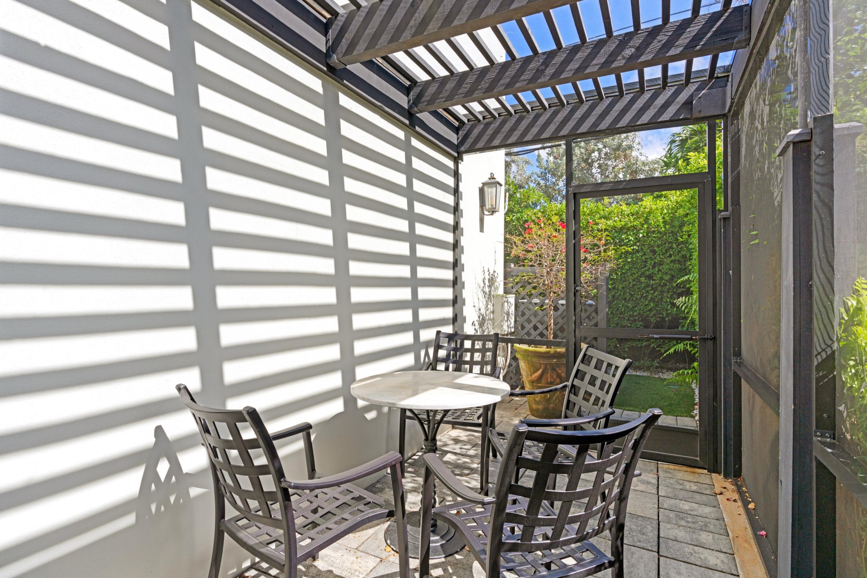 533 Westwood Road West Palm Beach, FL 33401 - Photo 32 of 43 a view of a dining room with furniture window and outside view