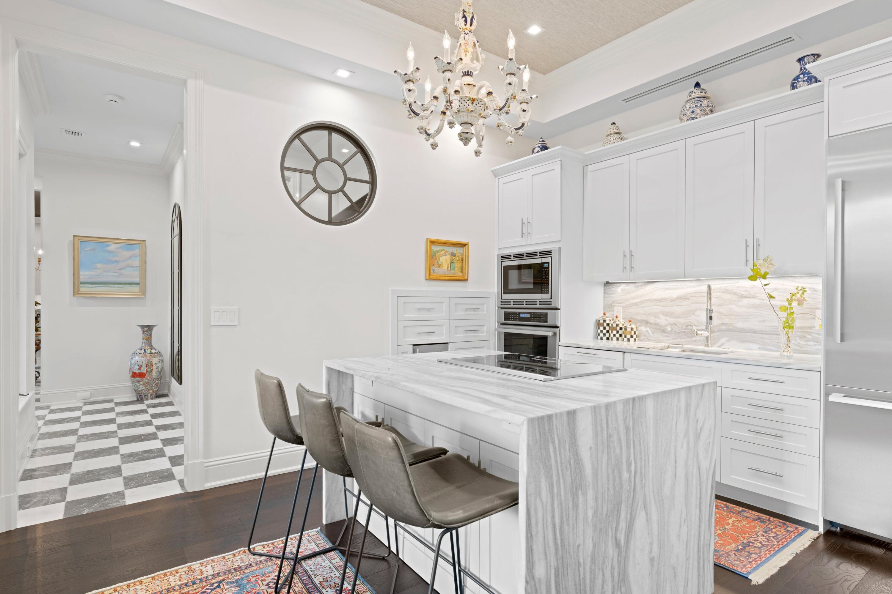 533 Westwood Road West Palm Beach, FL 33401 - Photo 10 of 43 a view of a dining room with furniture and a chandelier