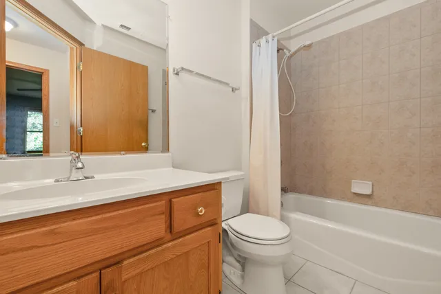 a bathroom with a sink a toilet and a bathtub