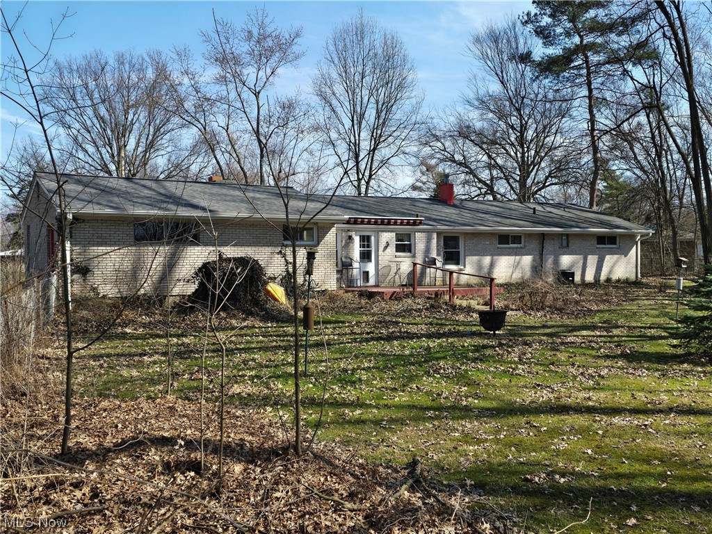 1450 Bonnie Road Macedonia, OH 44056 - Photo 13 of 21 Rear view of property featuring a deck and a yard