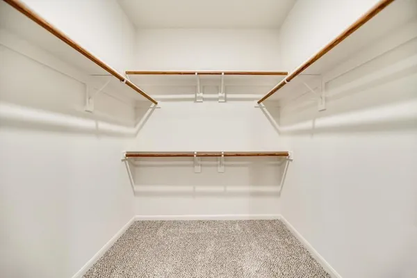 a view of an empty walk in closet