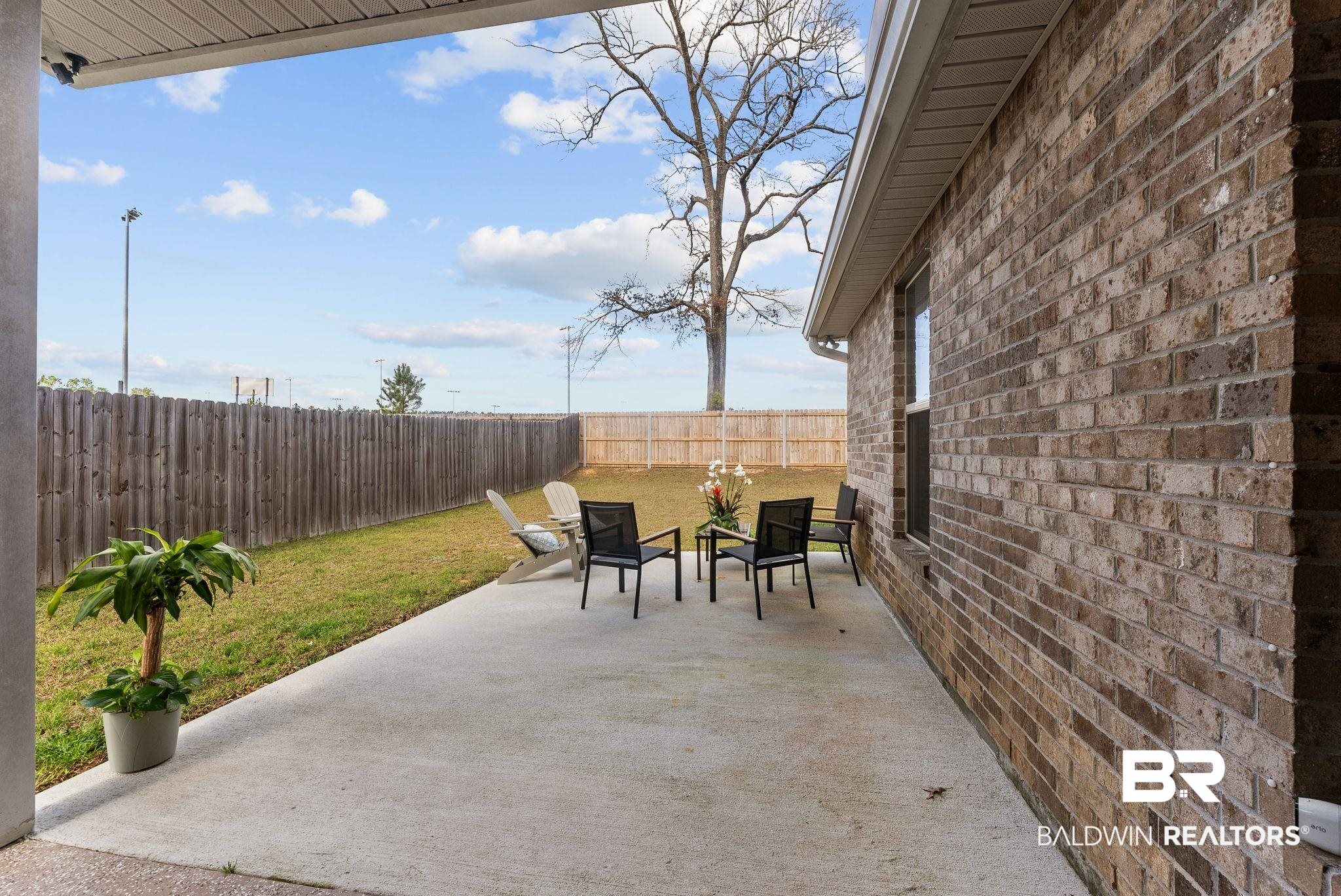 10745 Brodick Loop Daphne, AL 36527 - Photo 24 of 39 Fenced backyard with a patio area