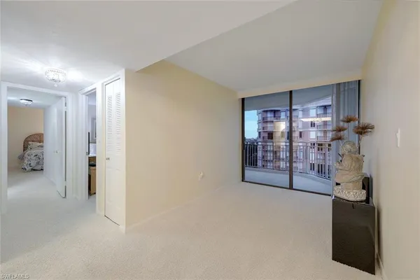 a view of an empty room with a fireplace