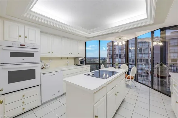 a kitchen that has a sink and a stove in it