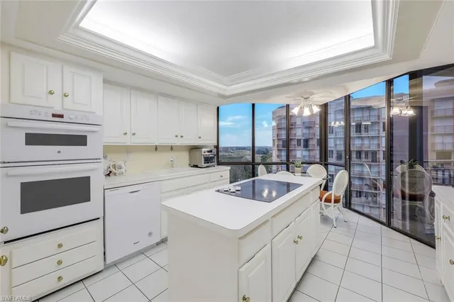 a kitchen that has a sink and a stove in it