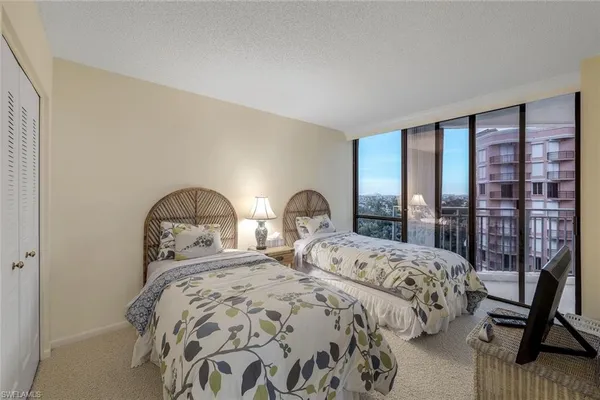 a bedroom with double bed and a window