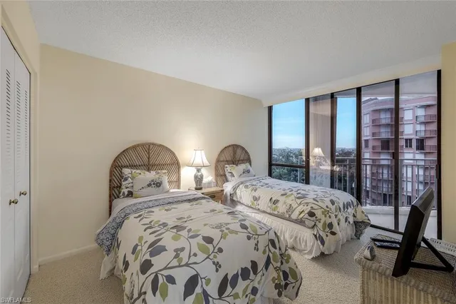 a bedroom with double bed and a window