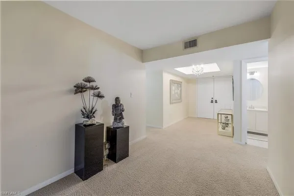 a view of a room with a hallway