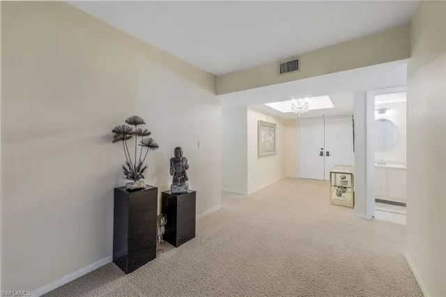 a view of a room with a hallway