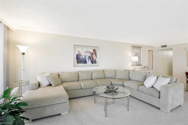 a living room with furniture and a couch