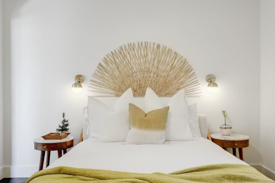 2901 Glen Rae Street, Unit A Austin, TX 78702 - Photo 16 of 36 a bedroom with a bed and a chandelier