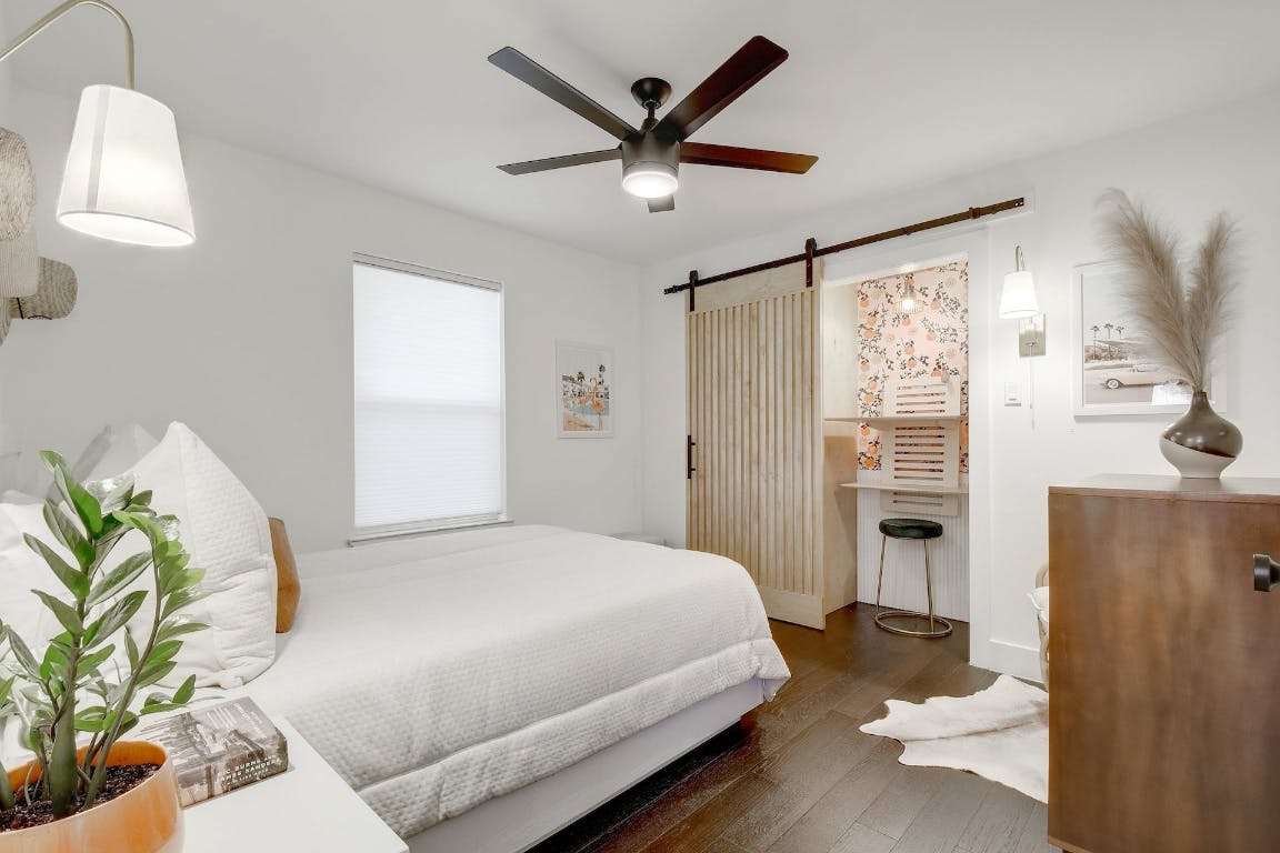 2901 Glen Rae Street, Unit A Austin, TX 78702 - Photo 22 of 36 a bedroom with a bed couch and a window