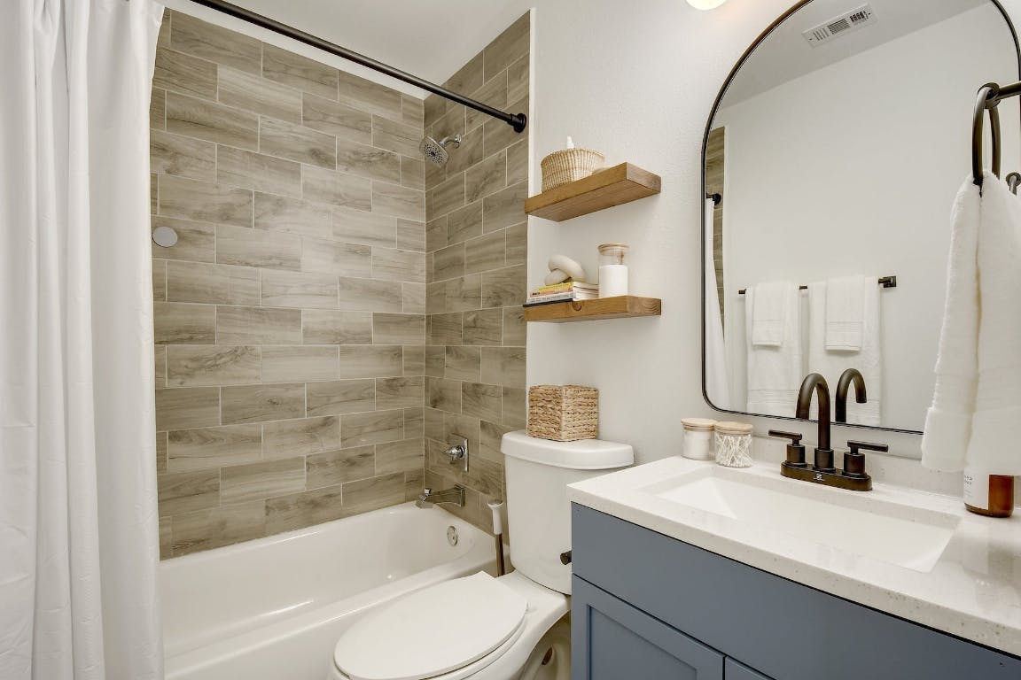 2901 Glen Rae Street, Unit A Austin, TX 78702 - Photo 28 of 36 a bathroom with a sink a toilet and shower
