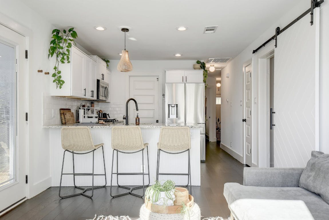 2901 Glen Rae Street, Unit A Austin, TX 78702 - Photo 4 of 36 a bathroom with a sink a mirror and a shower