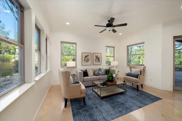 a bedroom with a large bed and a large window