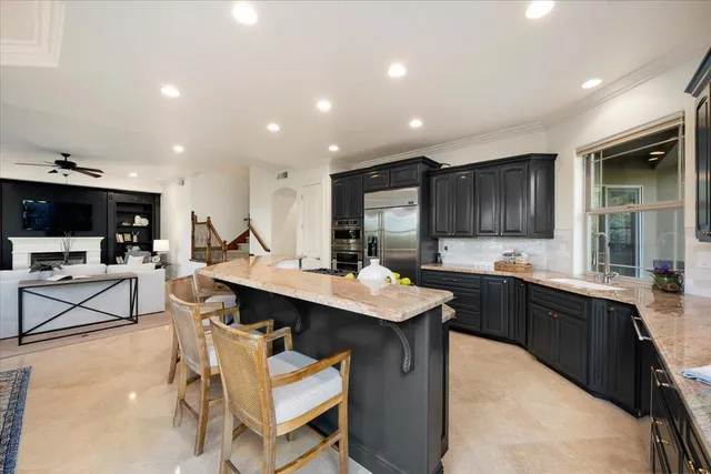 a en suite bathroom with a sink double vanity and a mirror