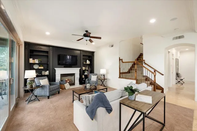 a view of a house with backyard outdoor space and sitting area