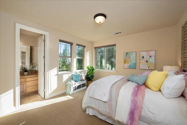 a view of a chairs and table in the backyard