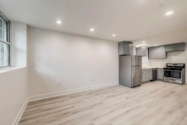 a view of kitchen with stainless steel appliances refrigerator and microwave