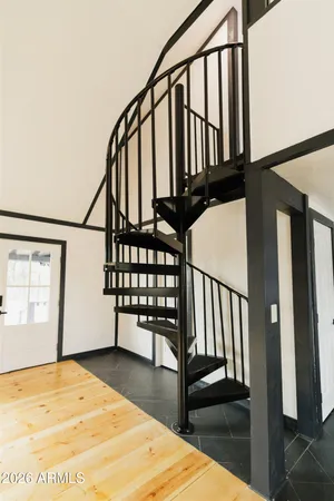 a view of a balcony with wooden floor