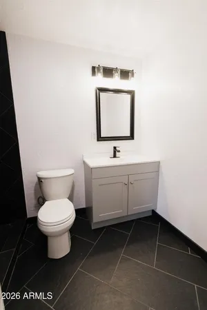 a view of a yard with trees in the background